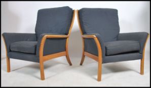 A pair of retro 20th century Parker Knoll armchairs. Measures 80cm high x 77cm wide x 80cm deep.