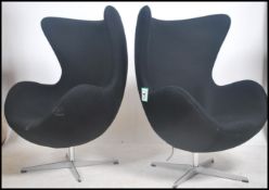 A fabulous pair of  Arne Jacobsen for Fritz Hansen style dark blue - black upholstered Egg