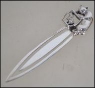 A contemporary pretty silver 925 bookmark of pierced tapering form, the mount with goldfish bowl and