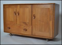 An Ercol 20th century elm wood sideboard of small