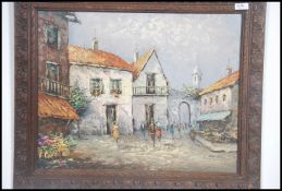 A 20th century oil on canvas painting study of a continental street scene by Bowman being set within