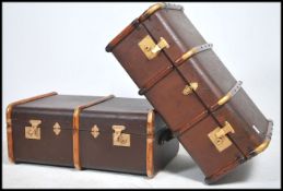 2 excellent quality early 20th century wooden and canvas bound steamer trunks having clasps to front