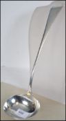 A very large Victorian silver hallmarked ladel by Walker & Hall having Sheffield hallmarks  for