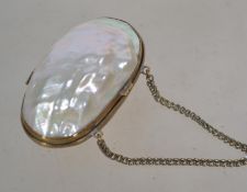 A late 19th century mother of pearl penny purse. The hinged body having a gilt mount, chain handle
