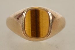 A 9ct gold / 375 marked tigers eye dress - signet ring bearing Sheffield hallmarks. Total weight 2.