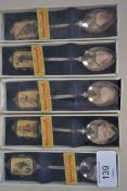 A set of 5 Hummel collectors ceramic and silver plate teaspoons complete in the original boxes. Made