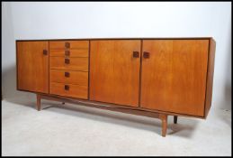A superb Danish manner teak wood sideboard by Kofod Larsen for G-Plan being raised on teak