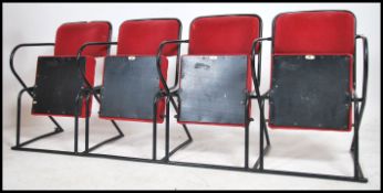 A set of 4 - run of 4 retro 20th century folding cinema chairs upholstered in red moquette fabric