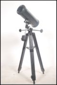 A contemporary Tasco telescope complete with the tripod stand ( see illustrations )