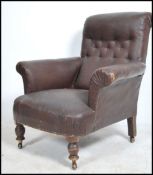 A Victorian mahogany library chesterfield armchair in the manner of Howard. The chair raised on