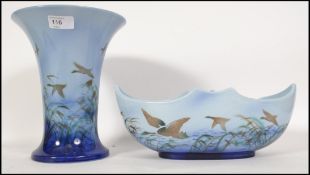 An early 20th century Sylvac Misty Rose vase together with a Modern Crescent similar pattern vase.
