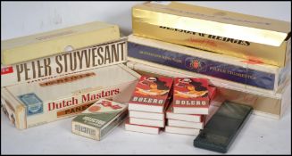 A collection of cigarettes and cigars dating from the 1980's to include Benson and Hedges, Peter