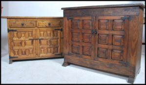 Two 20th century hardwood sideboards each having a series of doors opening to reveal shelving.
