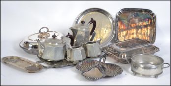 A collection of silver plated and pewter wares to include a Mayflower Pewter arts and crafts tea