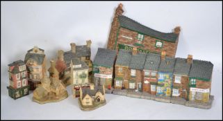 A collection of Lilliput Lane cottages to include Coronation Street, Rovers Return pub and others