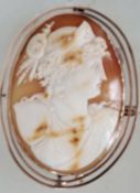 A 9ct gold hallmarked large carved shell cameo brooch featuring a classical bust wearing a crown