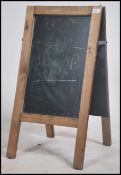A vintage 20th century school - Industrial double sided a-frame  chalkboard set within a wooden