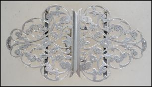 A late Victorian Silver hallmarked foliate design pierced two piece nurse buckle. Birmingham assay