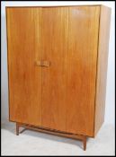 A superb Danish manner teak wood double wardrobe b