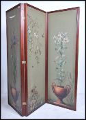 A late 19th century Victorian mahogany three fold dressing screen, with painted panels of fauna