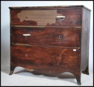 A Georgian mahogany chest of drawers raised on kick bracket legs having a series of deep drawers.