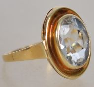 A 14ct gold / 585 marked ladies dress ring having oval cut aquamarine stone. Total weight 3.5g