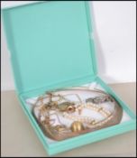 A collection of gilt silvered 925 jewellery to include a pearl bracelet, cocktail watch, earrings,