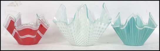 A collection of 3 vintage mid century glass handkerchief vases to include white banded edges,
