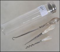 A silver hallmarked and cut glass dressing table brush pot, Birmingham 1912 together with a white