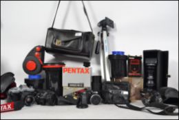 A collection of vintage cameras to include SLR along with accessories, dark room equipment etc ( see