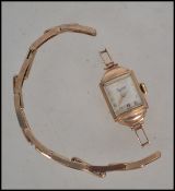 A 9ct gold ladies Everite dress watch and 9ct bracelet.  The braclet being hallmarked but af.