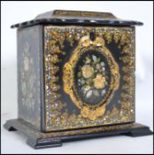 A 19th Century papier - mache sewing box / work box, the shaped rectangular lid having a finely