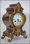 A 19th century French bracket clock having gilt ormulu embellished shaped case and raised on