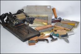 A vintage early 20th century Rejafix home table top printing machine complete with accessories.