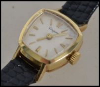 A vintage 14 carat gold ladies watch by Dugena.  This German watch is stamped 0'585, has a cream
