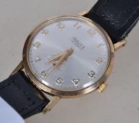 A vintage 1960's gentleman's wristwatch set to a black leather strap. The silvered dial with