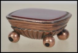 A Victorian 9ct gold and bloodstone agate seal base being of casket form with ball finial feet