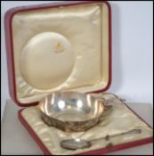 A silver hallmarked cased christening set by Francis Higgins the III. The set in red morocco leather
