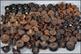 A large quantity of Victorian / Edwardian and later wooden furniture chest of drawers knobs, many