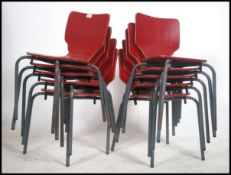 A set of 10 vintage childrens - school stacking chairs being raised on tubular metal fames with