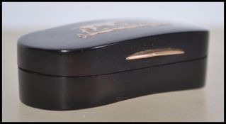 A 19th century Tortoiseshell and gold snuff  box of lovenge form. the lid having inset 9ct gold