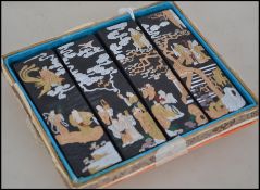 A set of 4 19th century Chinese ink sticks having gilded and silvered ink cakes with caligraphy to