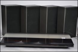 A Bang & Olufsen of Denmark Beocenter 2200 record player together with four speakers Beovox X25
