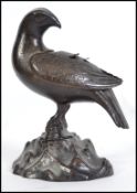 A believed early 20th century bronze pigeon having detachable wings revealing a recess for potpourri