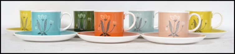 A retro Susie Cooper ceramic part tea service having a multi-coloured design and marked to the base.