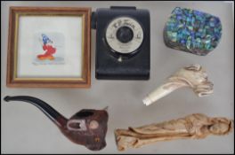A dealers lot to include a Briar smoking pipe in the form of a Buffalo, an abalone shell adorned