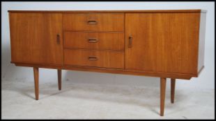A retro 1970's Danish style sideboard raised on sh