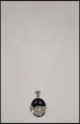 A ladies contemporary silver Onyx and marcasite leopard pendant necklace, the leopard pendant with