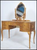 A gilded Louis 15th style kidney dressing table ra