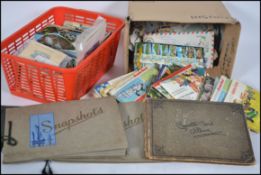 A good collection of vintage stamps and postcards to include mainly British and topographical etc.